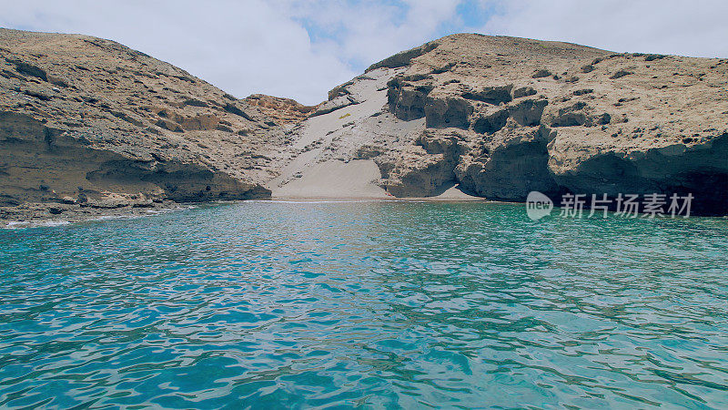 Aerial view of the hidden cove beach "La Rajita" at the natural reserve of "Monta?a Pelada" in Tenerife (Canary Islands). Drone shot